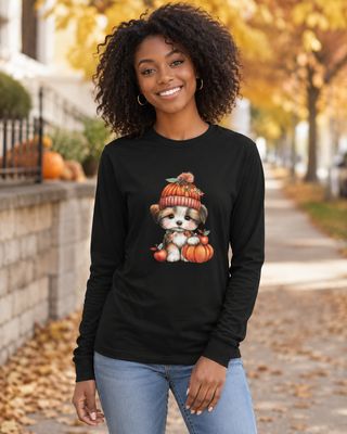 Black long sleeve fall shirt with cute puppy and pumpkin graphic modeled by a smiling woman outdoors.