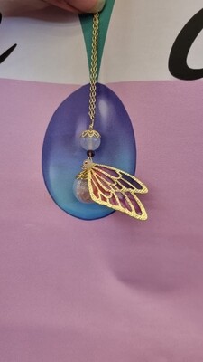 pendentif boule magique papillon pierre naturelle de quartz ride