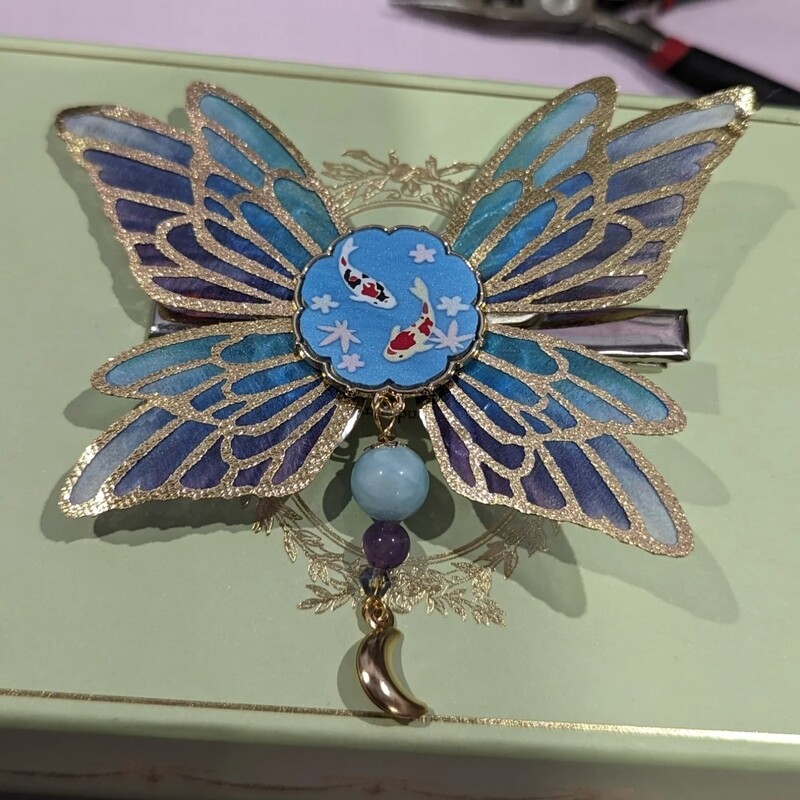 Pince cheveux papillon et carpes