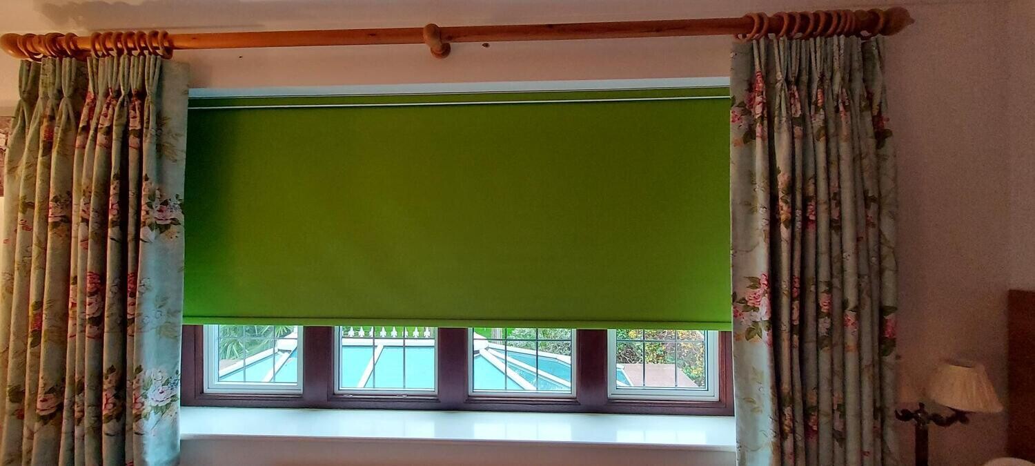 Green Blackout Blind in fabric-covered fascia