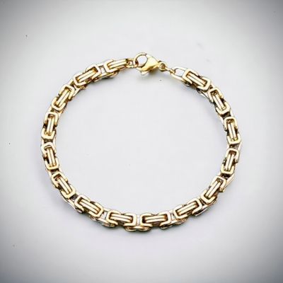 Elegant Gold and Silver Bracelet with Black Accents