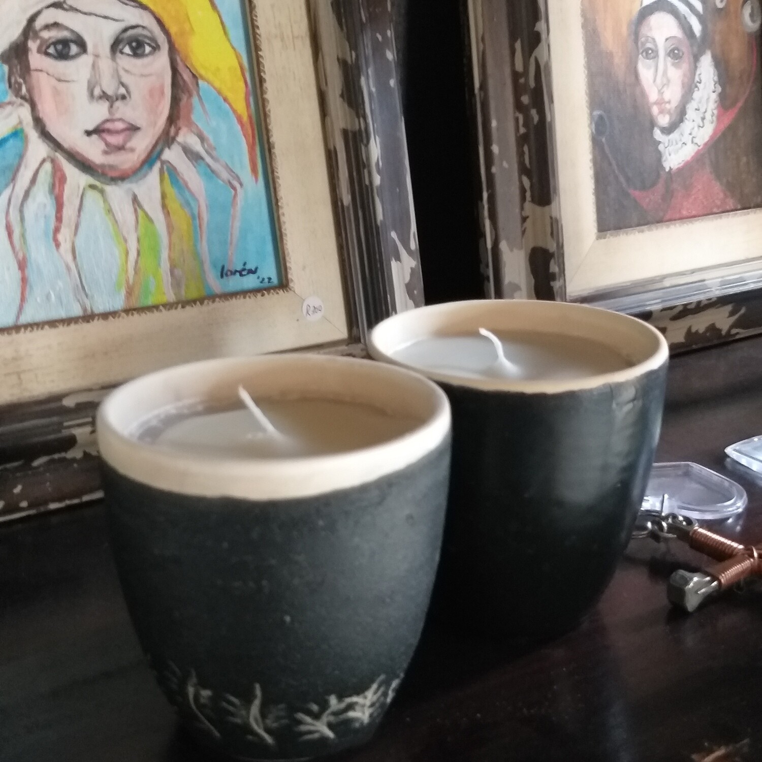 White candles in Ceramic cups