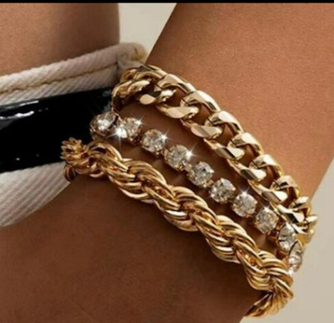 Gold & diamond bracelet set.