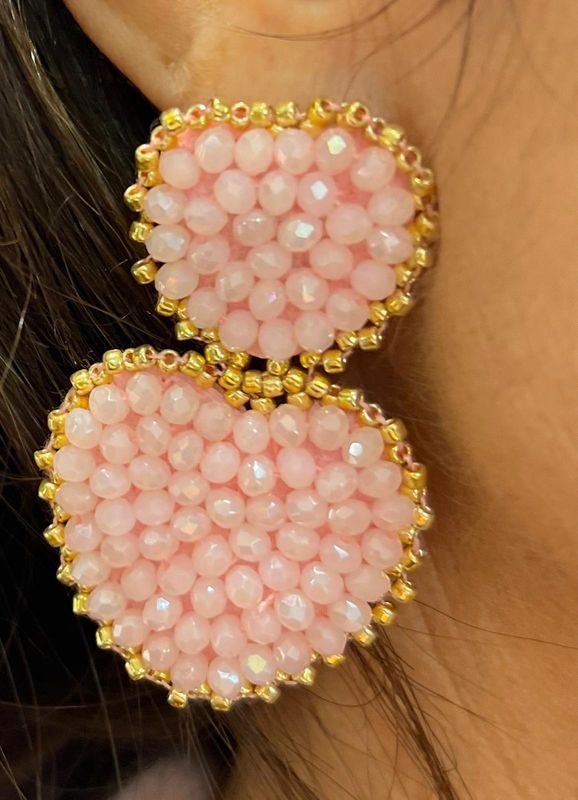 Lichtroze oorbellen in hartjes