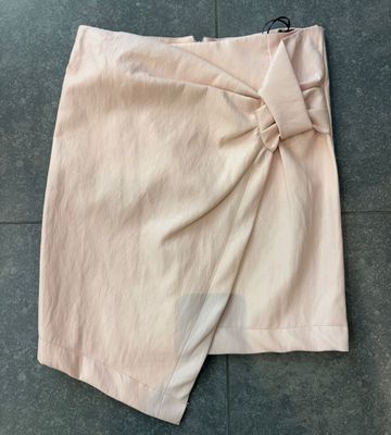 Roze rok in lederlook met vlecht