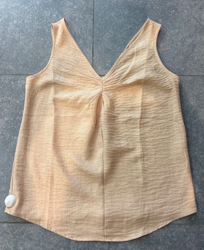 Topje zonder mouwen in het beige
