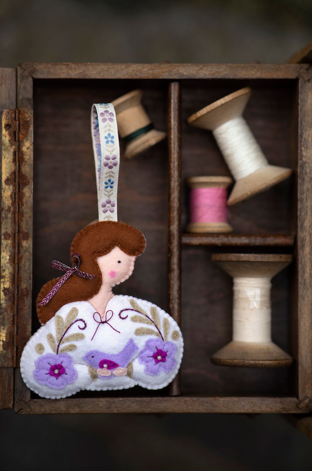 Girl holding a bird handmade felt decoration