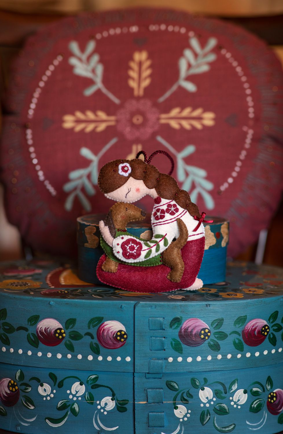 Girl holding a dachshund handmade felt decoration