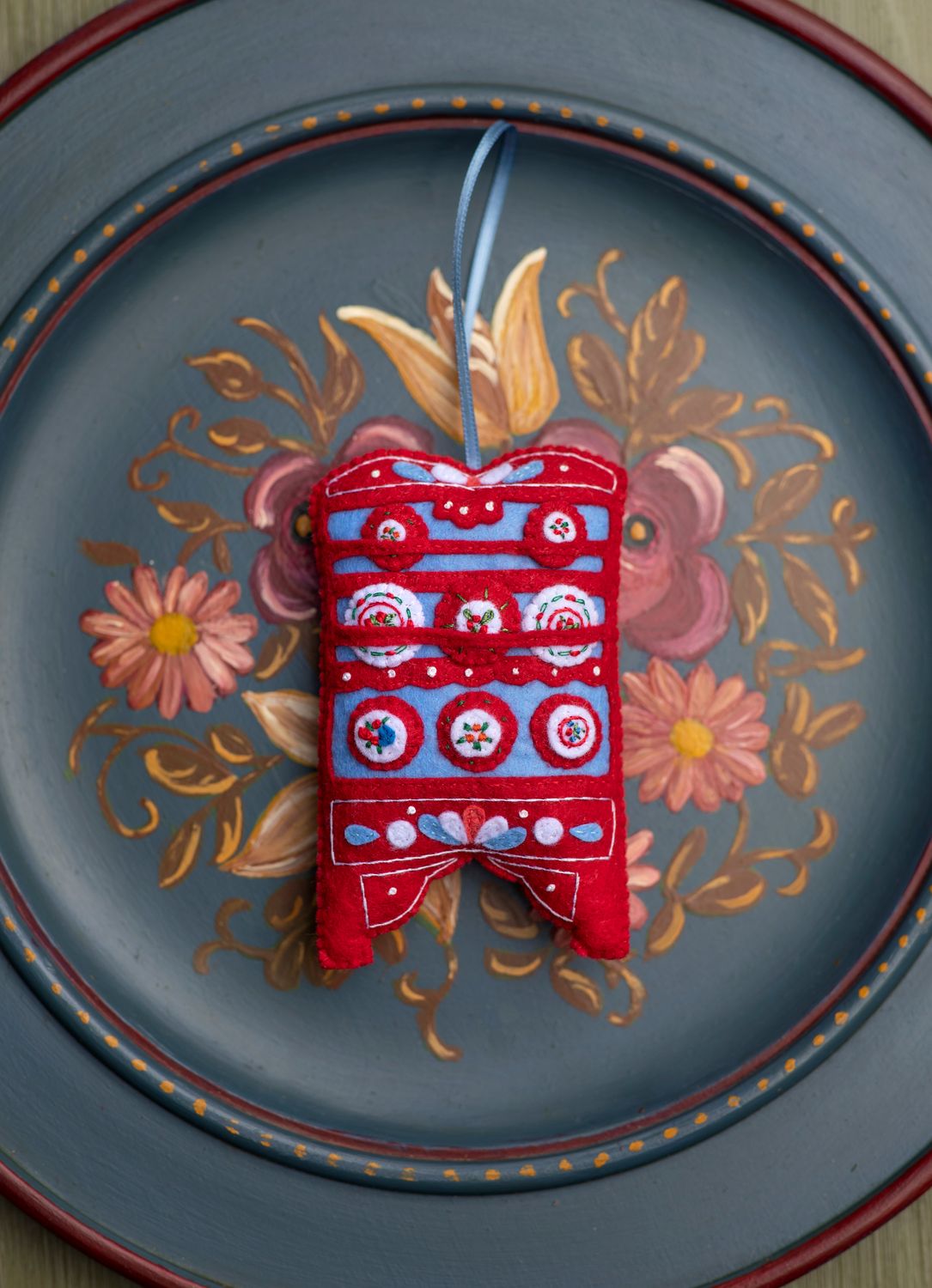 Red cupboard handmade felt decoration.