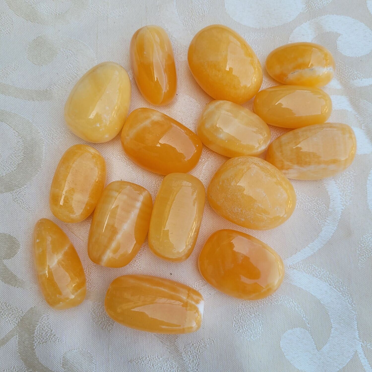 ​Trommelstein Calcit orange - 3 bis 3,5 cm