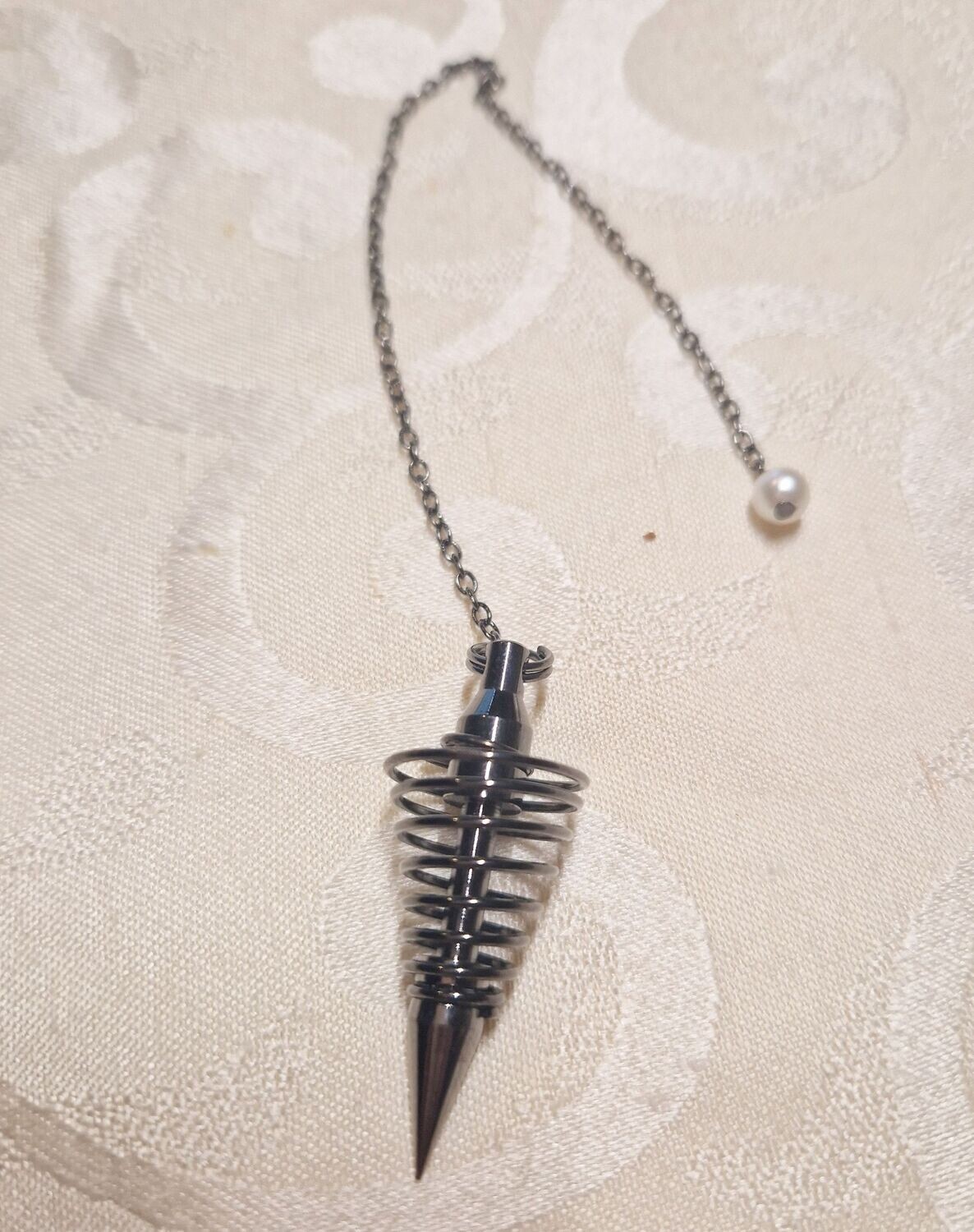 ​Pendelspirale - Messing titanfarbig - mit Tasche