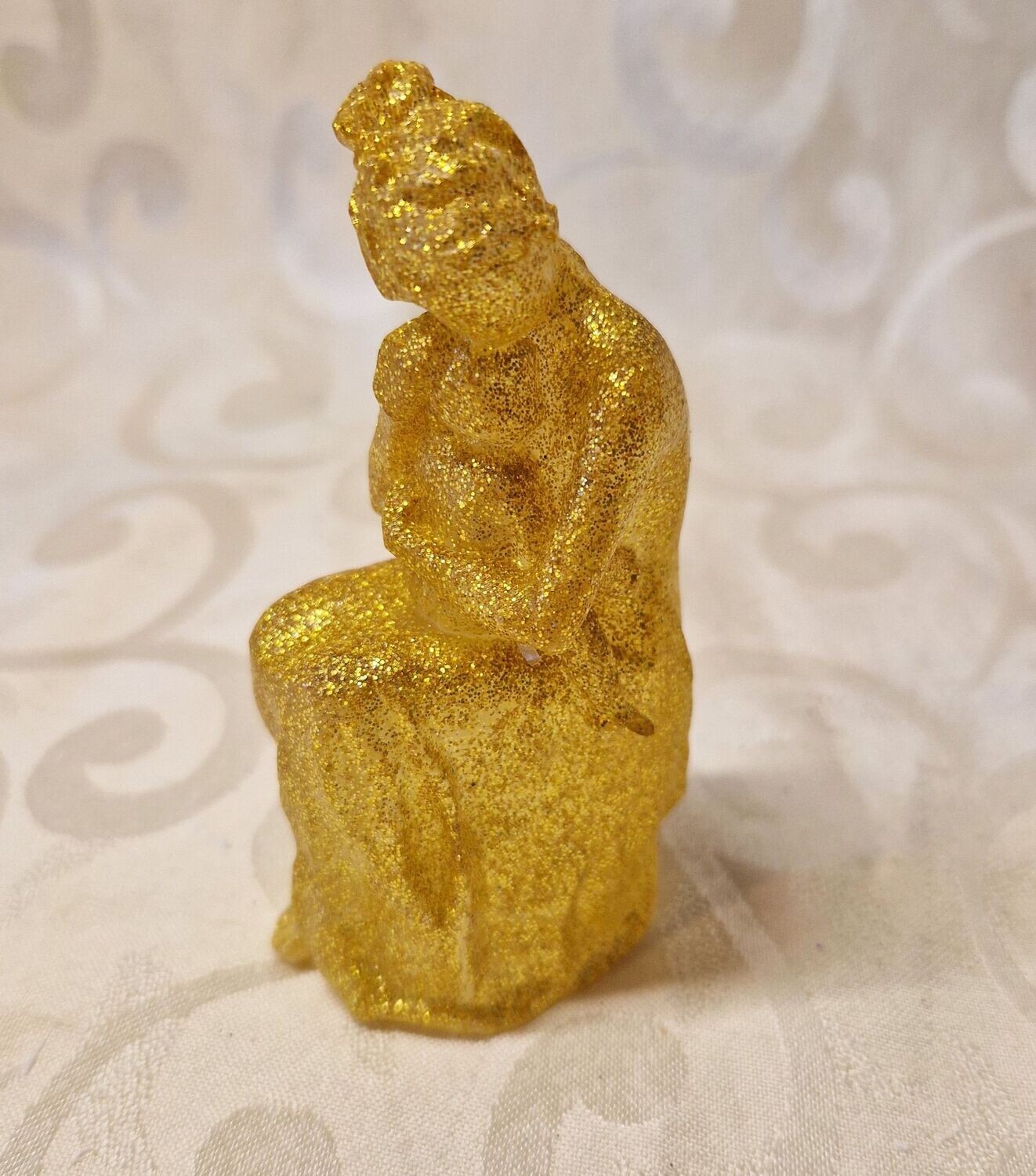 ​Mutter mit Baby in Gold-Glitzer