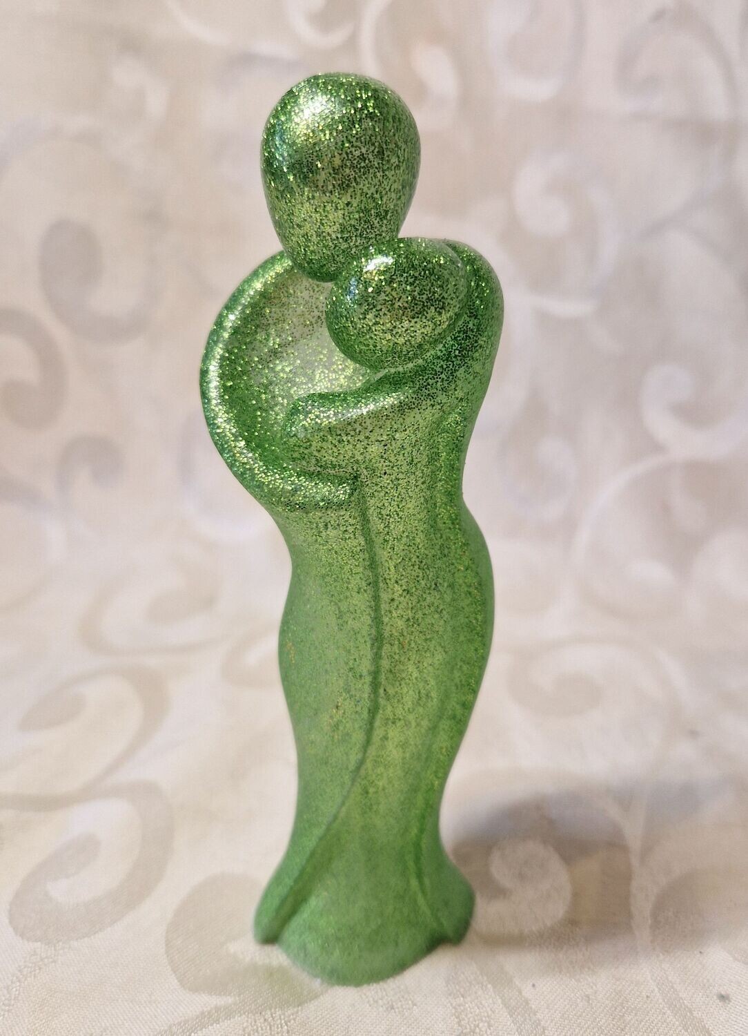 Mutter mit Baby in Grün-Glitzer