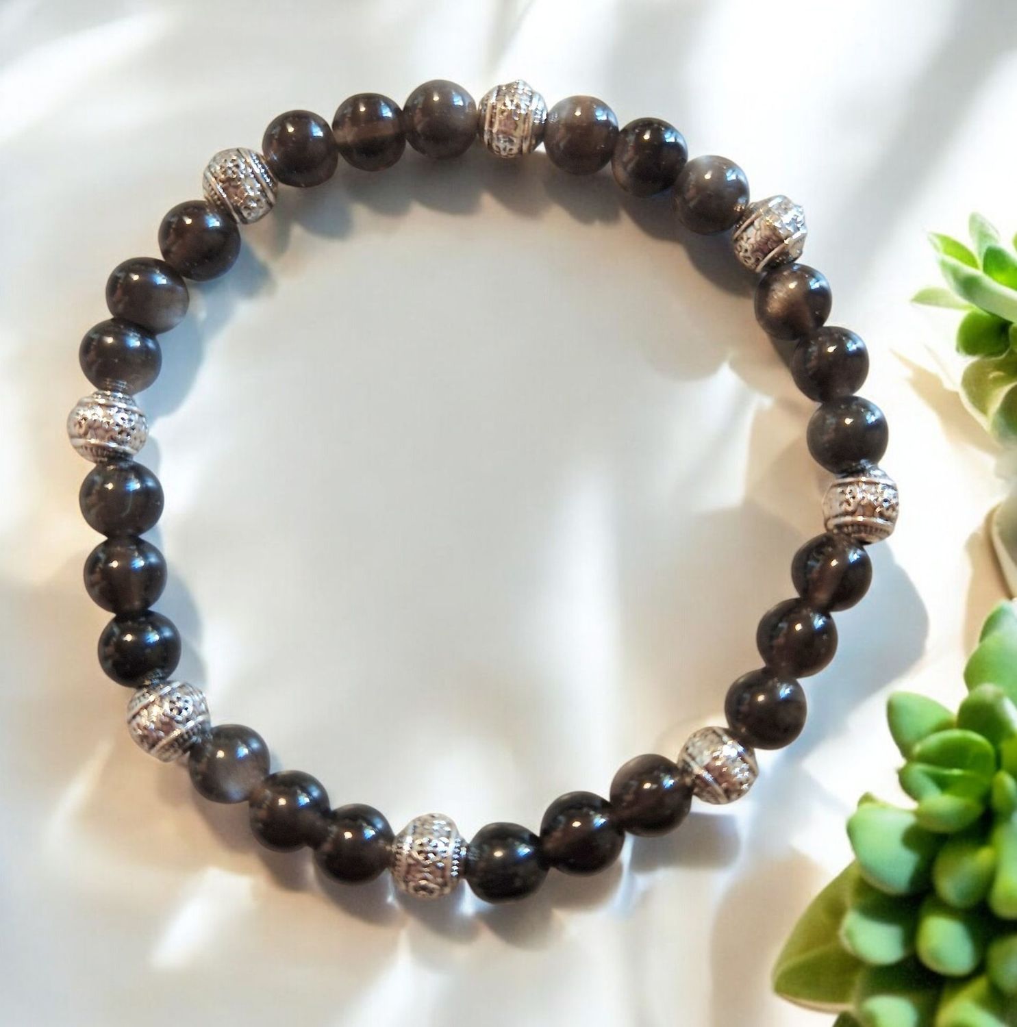 Armband - Obsidian silber - AA Qualität - mit silberfarbenen Metallelementen Armband - Obsidian silber - AA Qualität - mit silberfarbenen Metallelementen