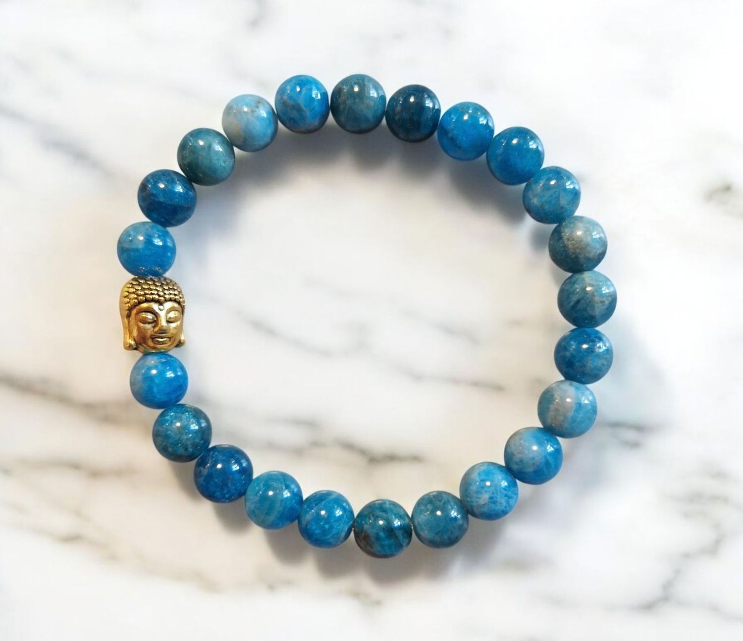 Armband - Apatit - A+ Qualität - mit goldfarbenem Buddha - 8 mm