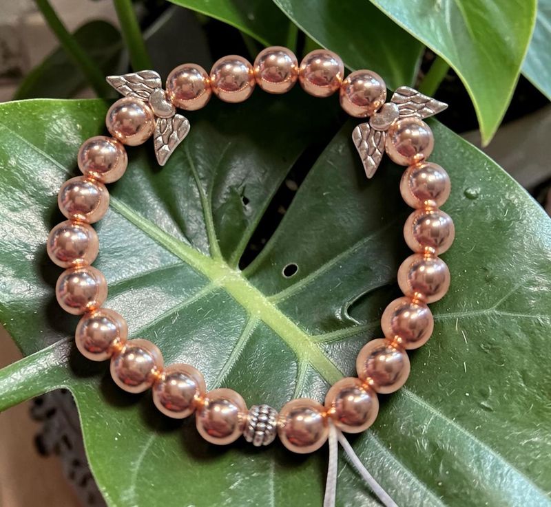 Engelsarmband - Hämatit in rosegoldfarben - A Qualität - mit silberfarbenen Engelsflügel - 8 mm