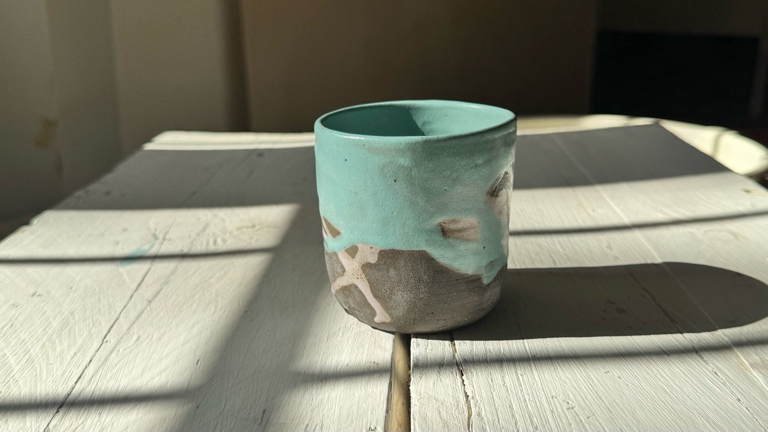 Black Clay Cup With Blue And Violet Glazes