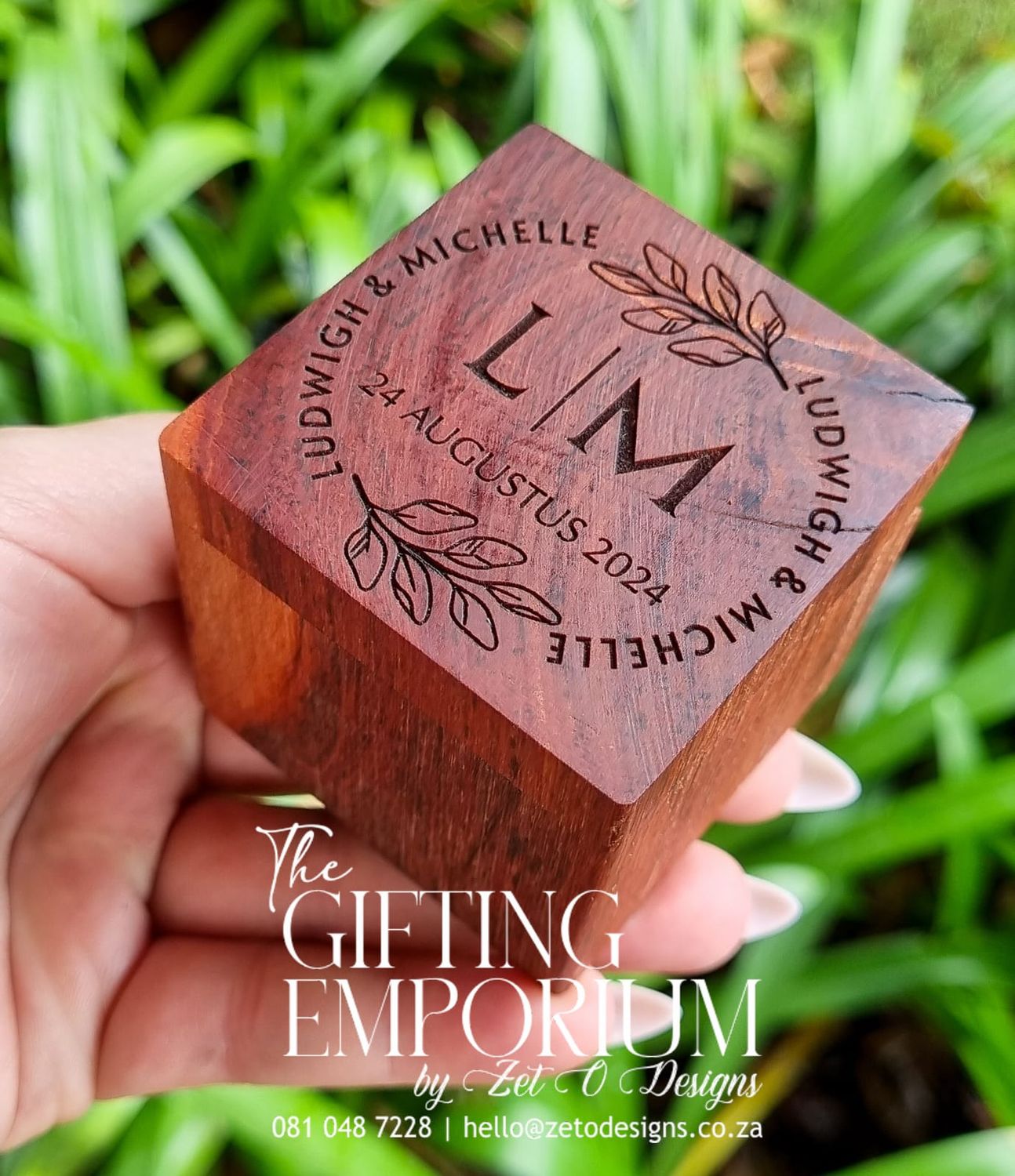 "Square Kiaat wooden ring box with custom engraving."
