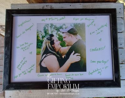 "A2 memory frame guestbook filled with handwritten messages and signatures from guests."
