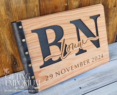Sleek black A4 guestbook with rivet binding and elegant design