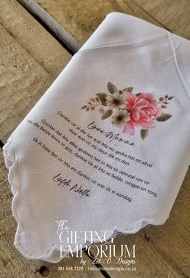 "White handkerchief with scallop edges featuring a custom printed design in the center