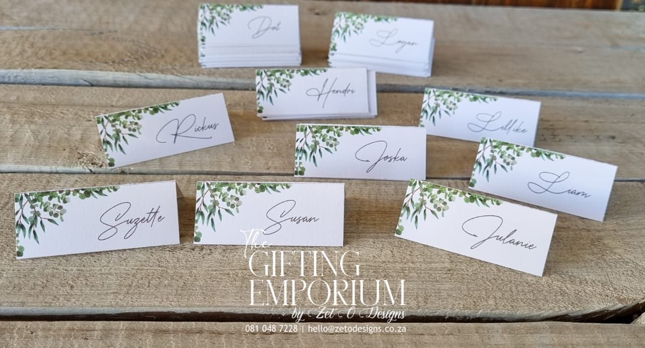 Elegant tent-style name cards custom printed with individual guest names for wedding table seating. Free-standing design on premium cardstock, perfect for receptions and formal events.