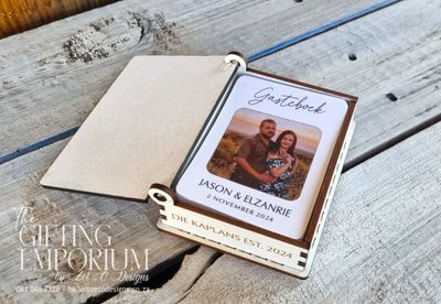 "A collection of playing cards laid out on a table, each one serving as a unique guestbook entry."
