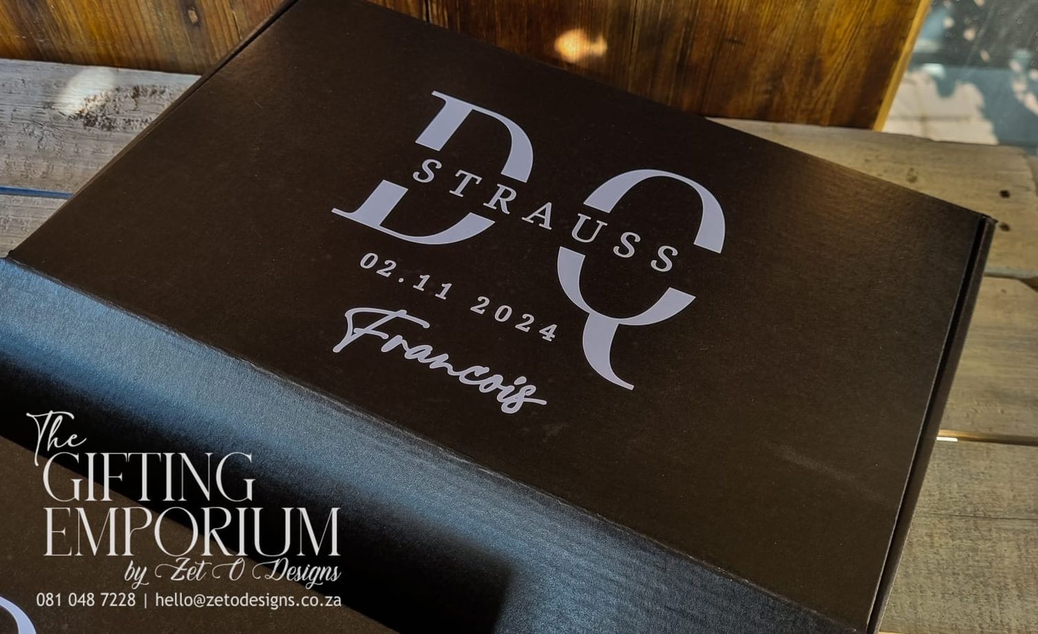 Custom black cardboard groomsman gift box combo with pocket knife, engraved flask, and wooden bottle opener