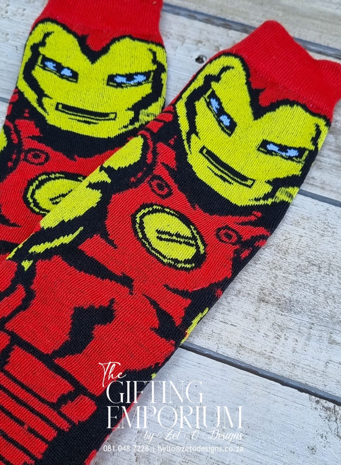 "A set of Iron Man-themed socks with bold red and gold colors, featuring the iconic Iron Man mask design."
