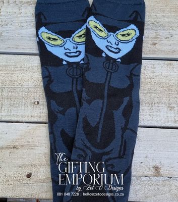 "Set of cozy women’s socks featuring playful cat designs."
