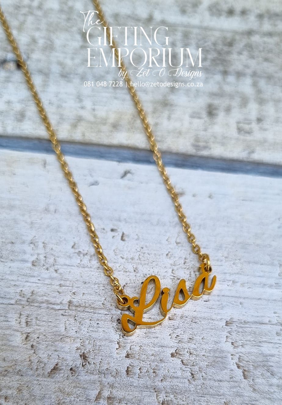 A stylish custom name cut-out necklace made from stainless steel and plated with 18k gold, featuring a personalized name in a sleek, modern font.