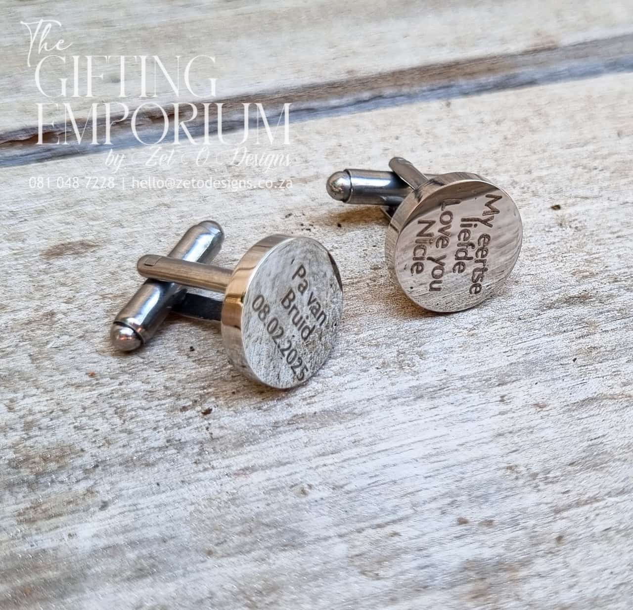 A pair of sleek, custom-engraved cufflinks with a polished finish, featuring a personalized name, initials, or date—perfect for adding a unique touch to any outfit.