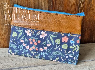"Personalized makeup bag made of genuine leather and canvas with custom engraving."

