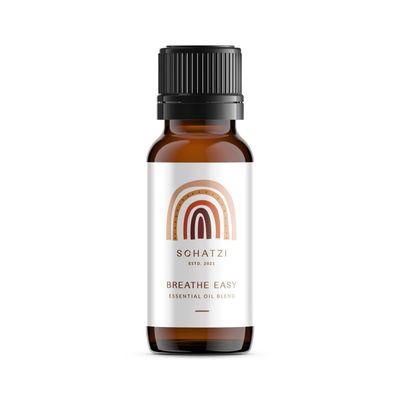 Essential Oil - Breath Easy Breath Easy Essential Oil bottle with natural ingredients like Clove, Tea Tree, Eucalyptus, and Peppermint, providing relief from nasal congestion for babies and adults.
