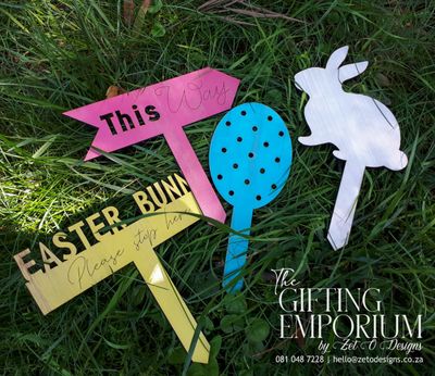 Handcrafted wooden Easter treasure hunt sign set featuring engraved clues and festive designs.
