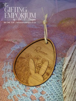 Double-layered wooden Easter egg tag with intricate design and customizable engraving.
