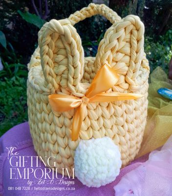 Custom-made crochet bunny basket with a fluffy tail, ideal for holding Easter eggs or as a charming spring décor piece.