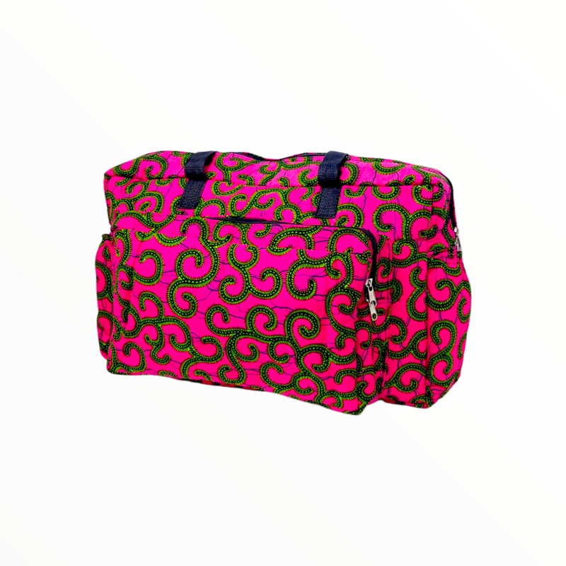 Brightly colored duffel bag featuring a vibrant pink background with bold green and black swirling patterns. Navy straps add contrast.