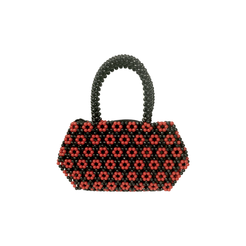 A beaded handbag with a black handle and body, adorned with a pattern of red flower-like clusters. The design is elegant and vibrant.
