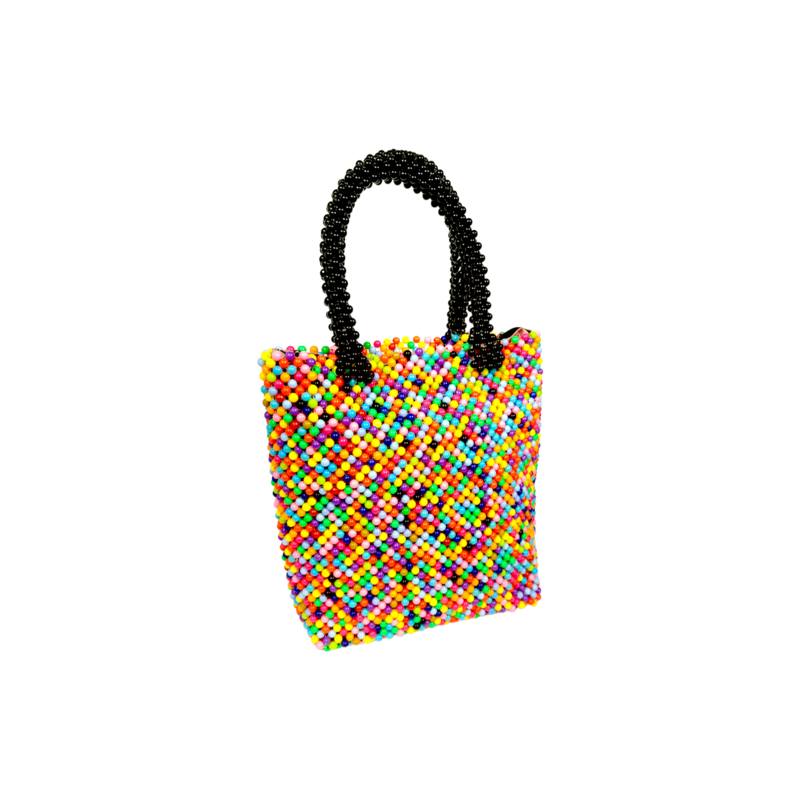 A vibrant handbag crafted from multicolored beads, featuring contrasting black beaded handles. The bag exudes a playful and artistic feel.