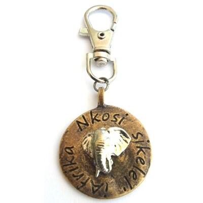 Elephant image on antique brass disc with bag clip attachment