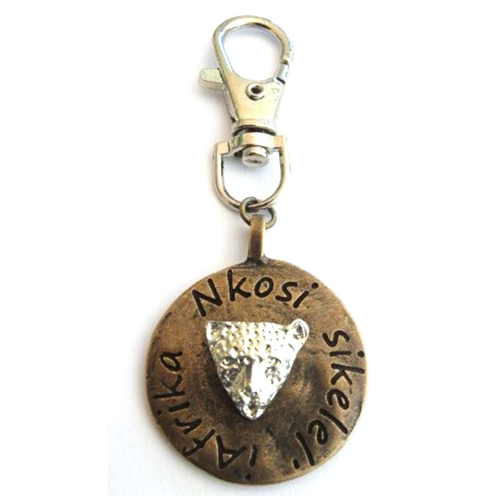Leopard image on antique brass disc with bag clip attachment