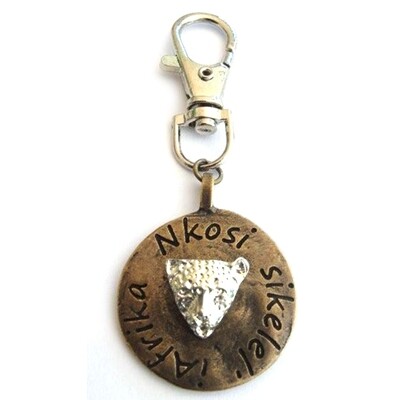 Leopard image on antique brass disc with bag clip attachment