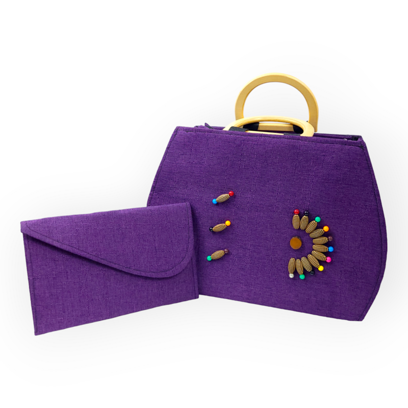 A purple fabric handbag and matching clutch with colorful bead embroidery and gold handles. The design is elegant and vibrant, evoking a playful tone.