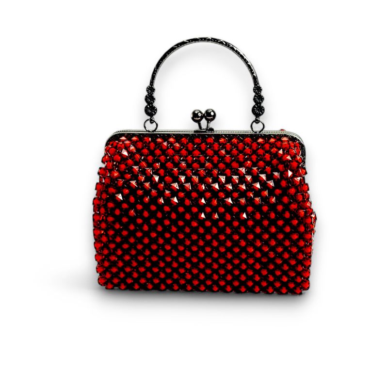 Elegant ruby beaded handbag with shimmering crystals and a silver clasp handle, set against a black background. The tone is luxurious and sophisticated.