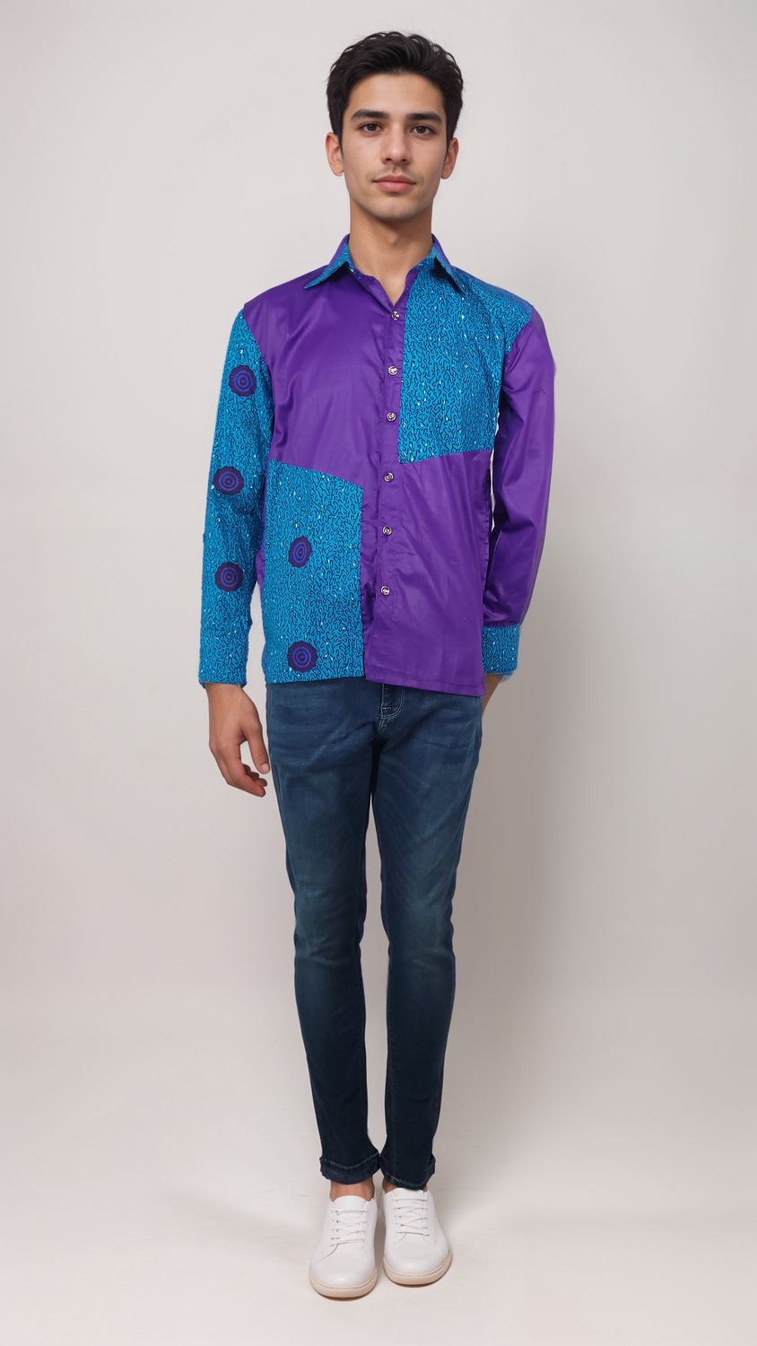 A man dressed in a bright purple shirt and denim jeans stands casually, radiating a laid-back yet fashionable vibe.