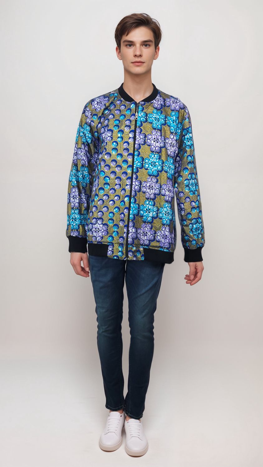 A man confidently sports a vibrant, patterned bomber jacket, showcasing a blend of colors and unique designs.