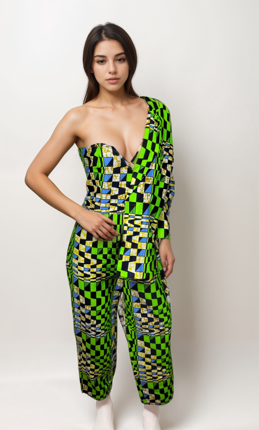 A woman confidently poses in a stylish green and black checkered jumpsuit, showcasing her vibrant fashion sense.