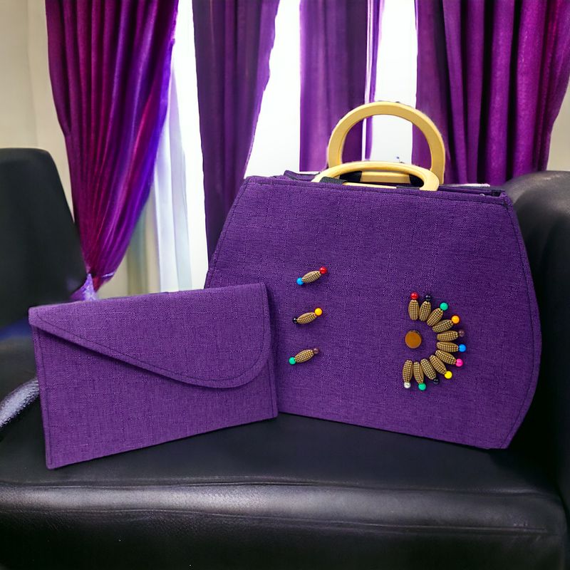 A purple fabric handbag and matching clutch with colorful bead embroidery and gold handles. The design is elegant and vibrant, evoking a playful tone.