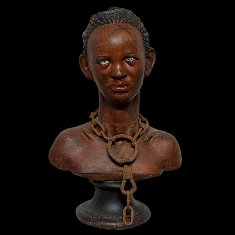 Polychrome terracotta sculpture representing a young black slave